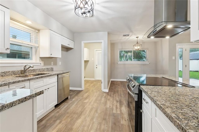4509 Purdue Dr, Metairie, LA 70003 - kitchen featuring electric range oven, dishwasher, a sink, range hood, and white cabinets