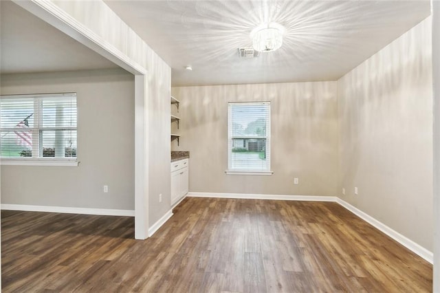 4509 Purdue Dr, Metairie, LA 70003 - empty room featuring dark wood finished floors and baseboards