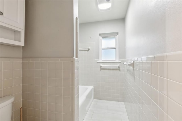 4509 Purdue Dr, Metairie, LA 70003 - full bathroom with tile walls, toilet, tile patterned flooring, and a wainscoted wall