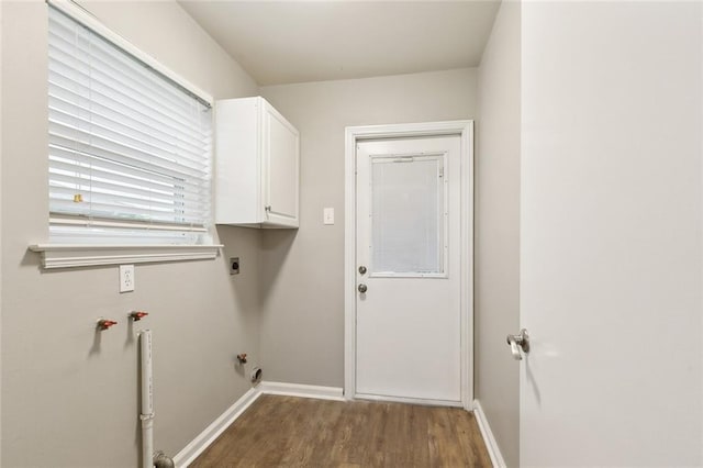 4509 Purdue Dr, Metairie, LA 70003 - washroom featuring cabinet space, electric dryer hookup, wood finished floors, and baseboards