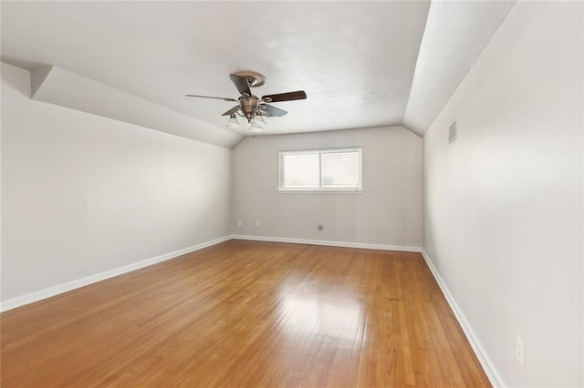 4509 Purdue Dr, Metairie, LA 70003 - spare room featuring vaulted ceiling, light wood finished floors, a ceiling fan, and baseboards