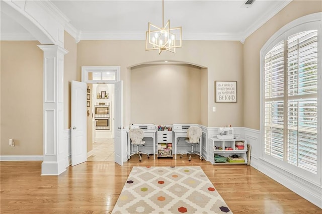 1067 Scarlet Oak Ln, Mandeville, LA 70448 - recreation room with arched walkways, plenty of natural light, ornate columns, ornamental molding, and a chandelier