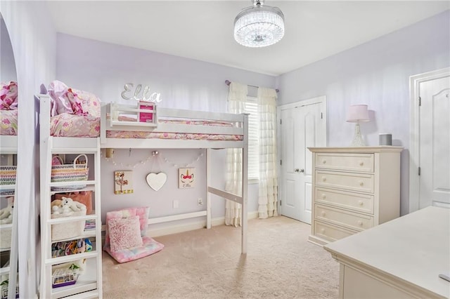 1067 Scarlet Oak Ln, Mandeville, LA 70448 - bedroom featuring light colored carpet, a chandelier, and baseboards