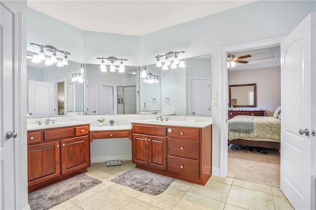 1067 Scarlet Oak Ln, Mandeville, LA 70448 - ensuite bathroom with double vanity, tile patterned floors, ceiling fan, and a shower with shower door