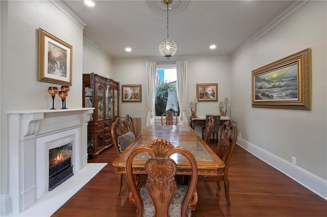 5936 Chestnut St, New Orleans, LA 70115 - dining space with crown molding, a fireplace, dark wood-type flooring, recessed lighting, and baseboards