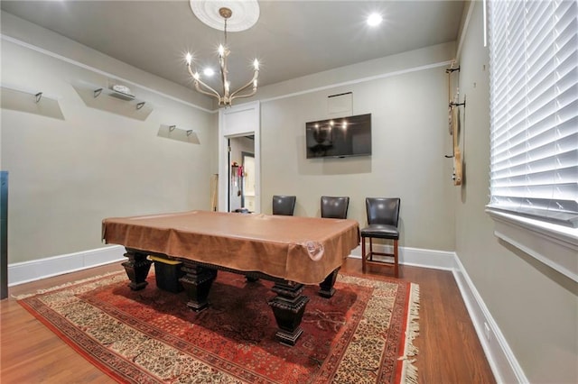 5936 Chestnut St, New Orleans, LA 70115 - playroom with billiards table, wood finished floors, baseboards, and a chandelier