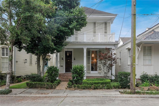 5936 Chestnut St, New Orleans, LA 70115 - view of front facade with a balcony and covered porch