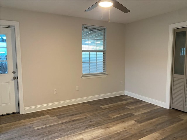 1919 Stephen Girard St, New Orleans, LA 70122 - empty room with dark wood finished floors, baseboards, and ceiling fan