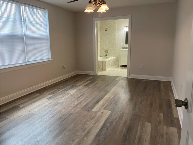 1919 Stephen Girard St, New Orleans, LA 70122 - empty room featuring a ceiling fan, baseboards, and wood finished floors