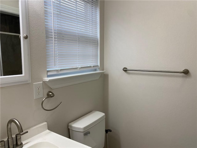 1919 Stephen Girard St, New Orleans, LA 70122 - bathroom with toilet, healthy amount of natural light, and vanity