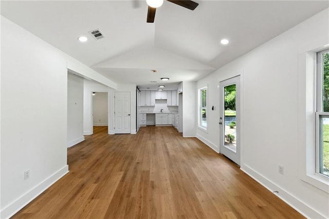35210 Windsor Dr, Slidell, LA 70460 - unfurnished living room with lofted ceiling, light wood-style floors, a ceiling fan, baseboards, and recessed lighting