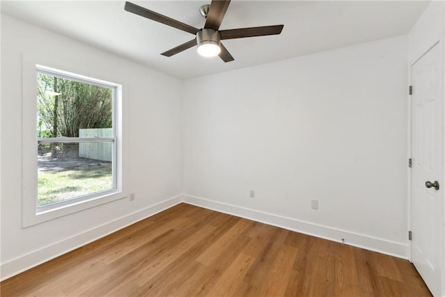 35210 Windsor Dr, Slidell, LA 70460 - empty room featuring light wood-style floors, baseboards, and ceiling fan