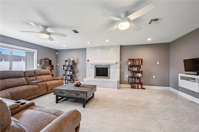3816 Jean Lafitte Pkwy, Chalmette, LA 70043 - living room with ceiling fan, a fireplace, baseboards, and recessed lighting