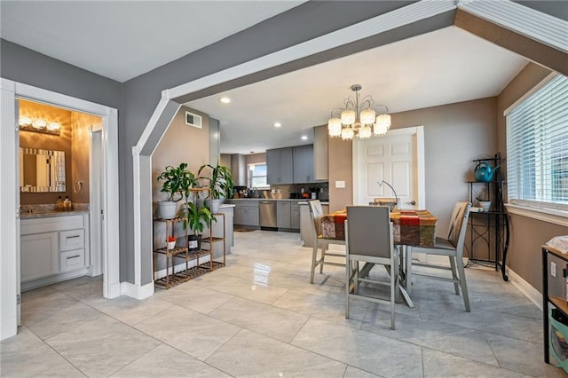 3816 Jean Lafitte Pkwy, Chalmette, LA 70043 - dining room featuring a chandelier, healthy amount of natural light, baseboards, and recessed lighting