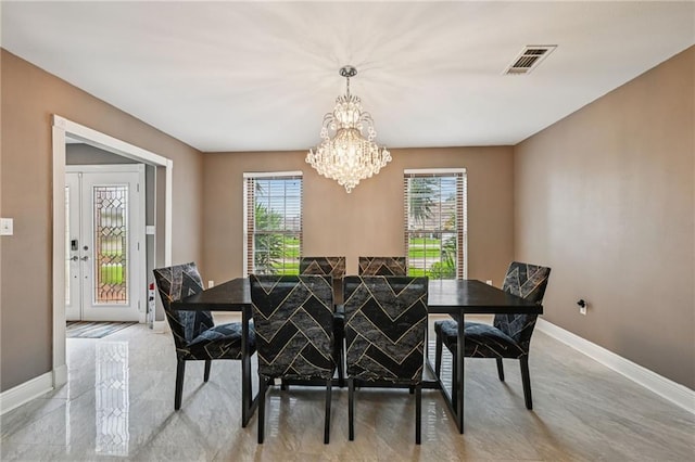 3816 Jean Lafitte Pkwy, Chalmette, LA 70043 - dining area featuring a chandelier and baseboards