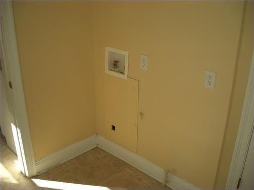 2607 Soniat St, New Orleans, LA 70115 - washroom with washer hookup and baseboards