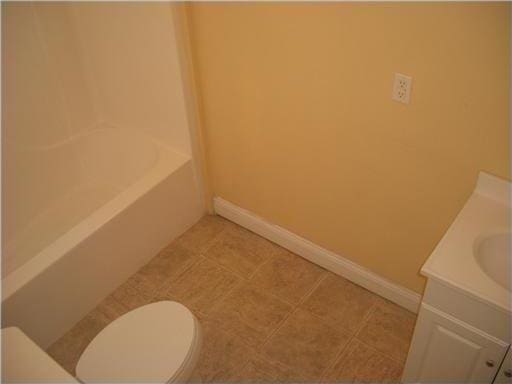 2607 Soniat St, New Orleans, LA 70115 - full bath with vanity, a tub, and a shower
