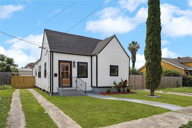 2327 Pauline St, New Orleans, LA 70117 - view of front of property featuring roof with shingles