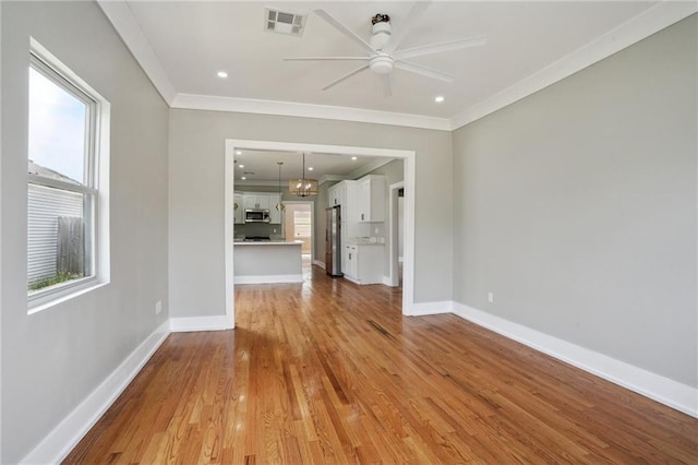 2327 Pauline St, New Orleans, LA 70117 - unfurnished living room with ceiling fan, ornamental molding, baseboards, light wood-type flooring, and recessed lighting