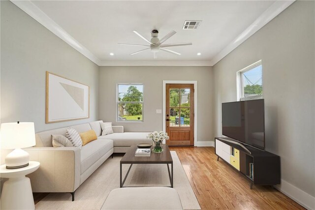 2327 Pauline St, New Orleans, LA 70117 - living room with healthy amount of natural light, ceiling fan, light wood-type flooring, ornamental molding, and recessed lighting