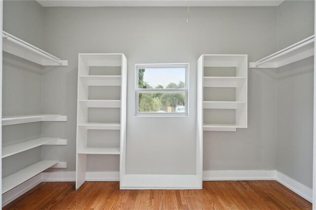 2327 Pauline St, New Orleans, LA 70117 - walk in closet with wood finished floors
