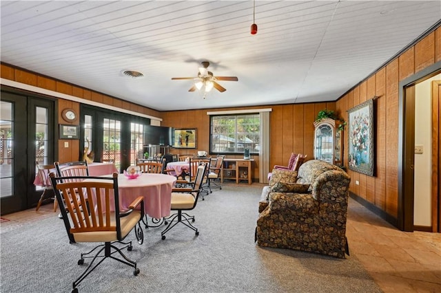 2108 Washington St, Franklinton, LA 70438 - living area featuring ceiling fan, wooden walls, and french doors