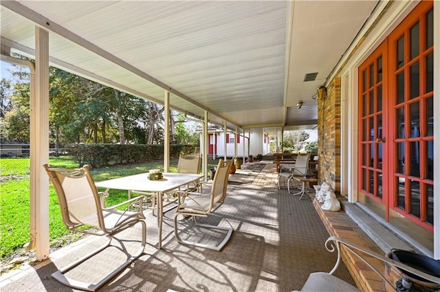 2108 Washington St, Franklinton, LA 70438 - view of patio with outdoor dining area and french doors