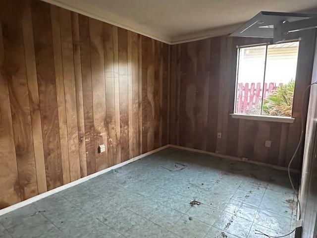 9416 Cabildo Ln, Westwego, LA 70094 - empty room with wood walls