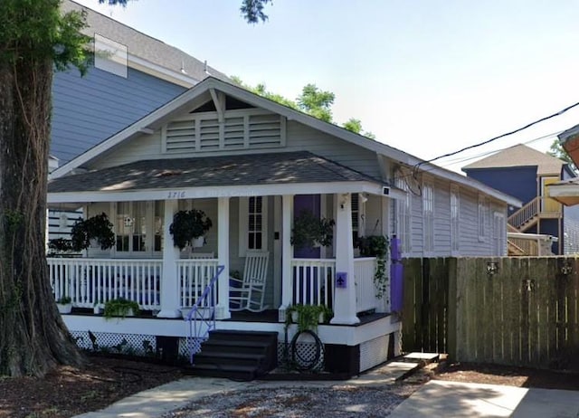 2716 Lavender St, New Orleans, LA 70122 - view of front facade featuring a porch and a shingled roof