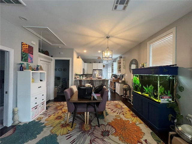 2716 Lavender St, New Orleans, LA 70122 - dining space with attic access, recessed lighting, and wood finished floors