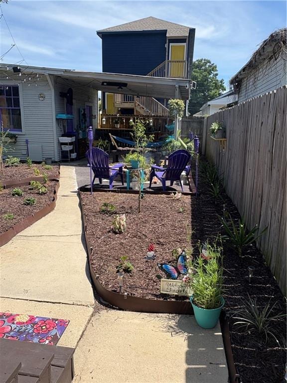 2716 Lavender St, New Orleans, LA 70122 - fenced yard with a patio and stairway