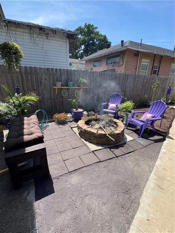 2716 Lavender St, New Orleans, LA 70122 - view of patio / terrace with an outdoor fire pit