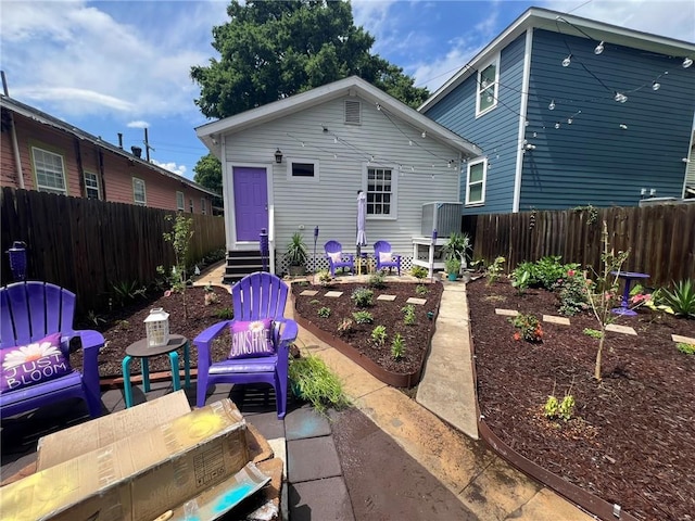 2716 Lavender St, New Orleans, LA 70122 - rear view of property with entry steps, a fenced backyard, and a patio