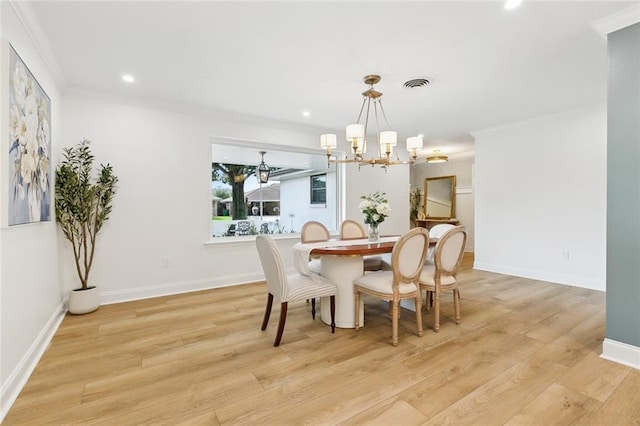 4905 Haring Ct, Metairie, LA 70006 - dining area with a chandelier, ornamental molding, light wood-style flooring, recessed lighting, and baseboards