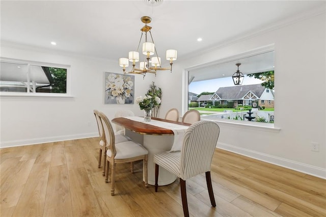 4905 Haring Ct, Metairie, LA 70006 - dining area with a chandelier, ornamental molding, wood finished floors, baseboards, and recessed lighting