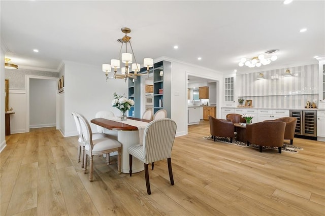 4905 Haring Ct, Metairie, LA 70006 - dining room with beverage cooler, crown molding, a chandelier, light wood finished floors, and bar