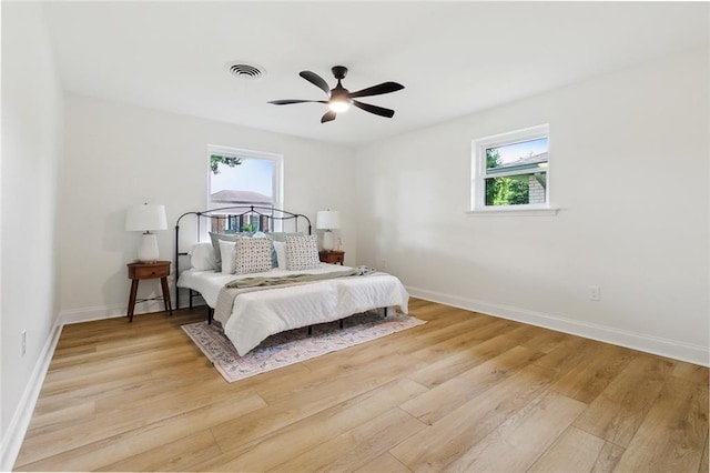 4905 Haring Ct, Metairie, LA 70006 - bedroom with light wood-style flooring, baseboards, and a ceiling fan