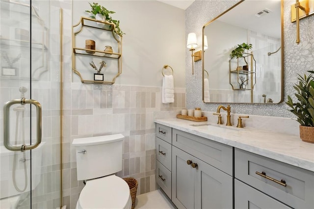 4905 Haring Ct, Metairie, LA 70006 - full bath featuring vanity, a shower stall, toilet, and tile walls