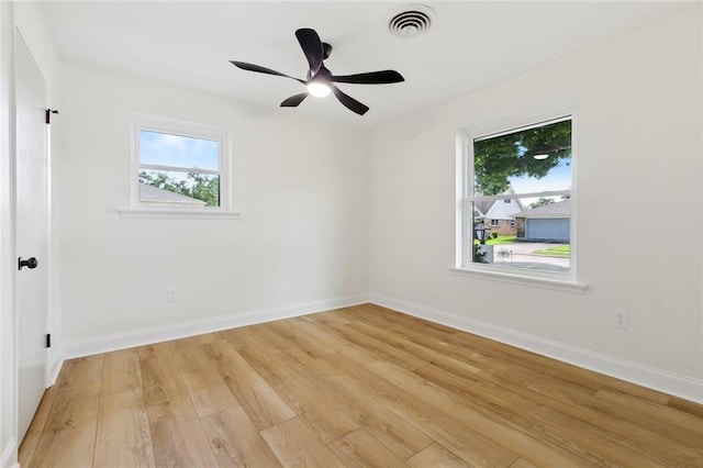 4905 Haring Ct, Metairie, LA 70006 - unfurnished room with plenty of natural light, light wood finished floors, baseboards, and a ceiling fan