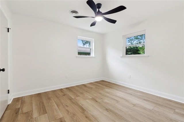 4905 Haring Ct, Metairie, LA 70006 - unfurnished room with plenty of natural light, light wood-style flooring, baseboards, and a ceiling fan