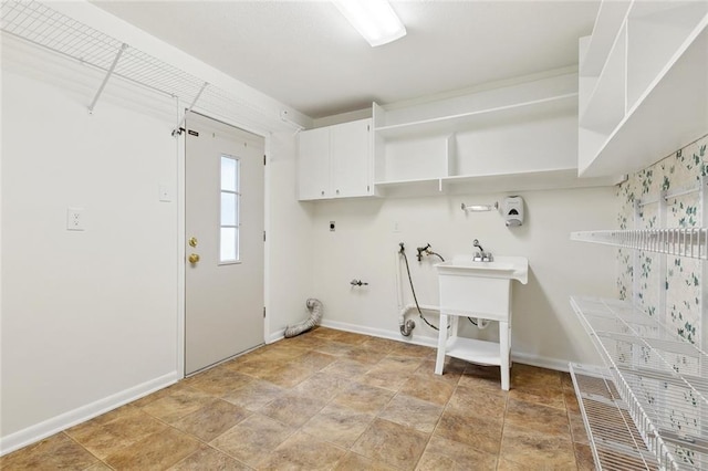 4905 Haring Ct, Metairie, LA 70006 - laundry area with washer hookup, cabinet space, baseboards, and hookup for an electric dryer