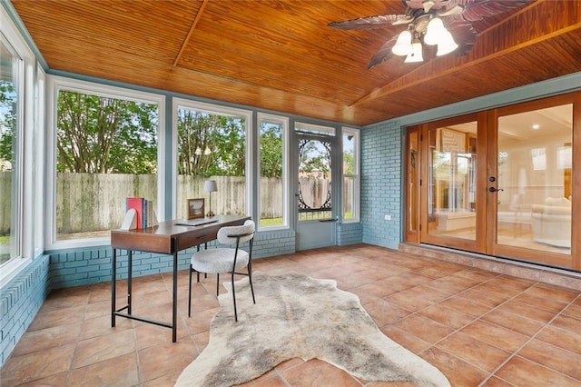 4905 Haring Ct, Metairie, LA 70006 - sunroom with wooden ceiling, brick wall, french doors, plenty of natural light, and tile patterned flooring