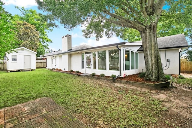 4905 Haring Ct, Metairie, LA 70006 - rear view of property featuring a chimney, a sunroom, and stucco siding