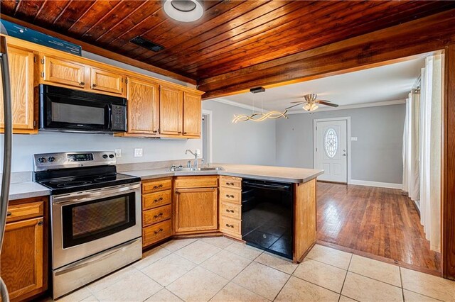 1017 Marian Ave, Metairie, LA 70001 - kitchen with black appliances, a sink, a peninsula, crown molding, and light tile patterned floors