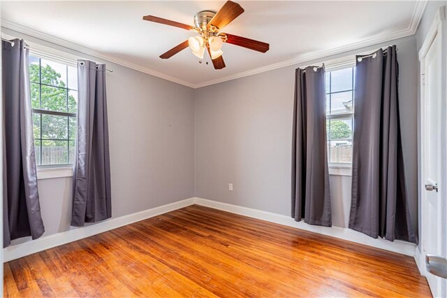 1017 Marian Ave, Metairie, LA 70001 - spare room featuring light wood-style flooring, crown molding, baseboards, and ceiling fan