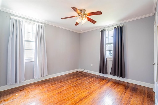 1017 Marian Ave, Metairie, LA 70001 - unfurnished room featuring hardwood / wood-style flooring, a ceiling fan, baseboards, and crown molding