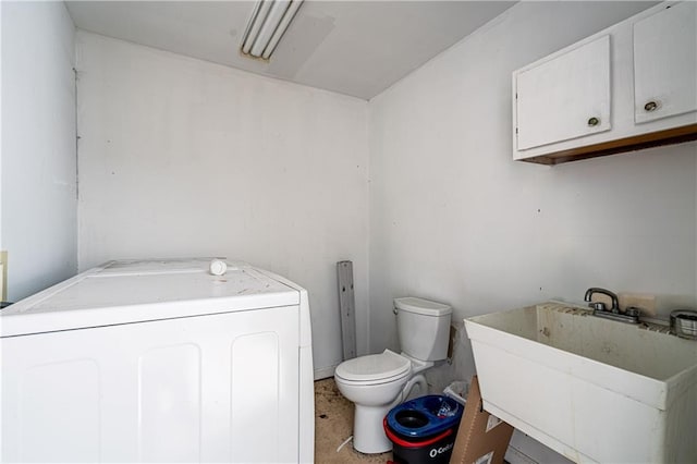 1017 Marian Ave, Metairie, LA 70001 - bathroom with washer / clothes dryer, toilet, and a sink
