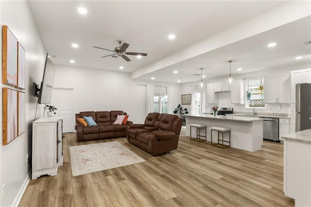 2641 Anchor Dr, Marrero, LA 70072 - living room featuring light wood-style floors, recessed lighting, ceiling fan, and baseboards