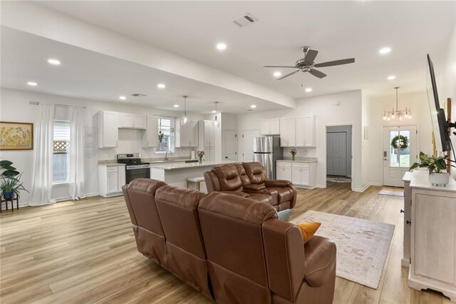 2641 Anchor Dr, Marrero, LA 70072 - living area with light wood-style flooring, plenty of natural light, ceiling fan, recessed lighting, and baseboards