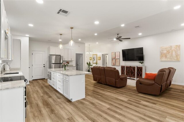 2641 Anchor Dr, Marrero, LA 70072 - kitchen featuring appliances with stainless steel finishes, a sink, a ceiling fan, white cabinets, and recessed lighting